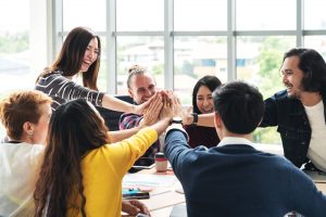 group of people high five